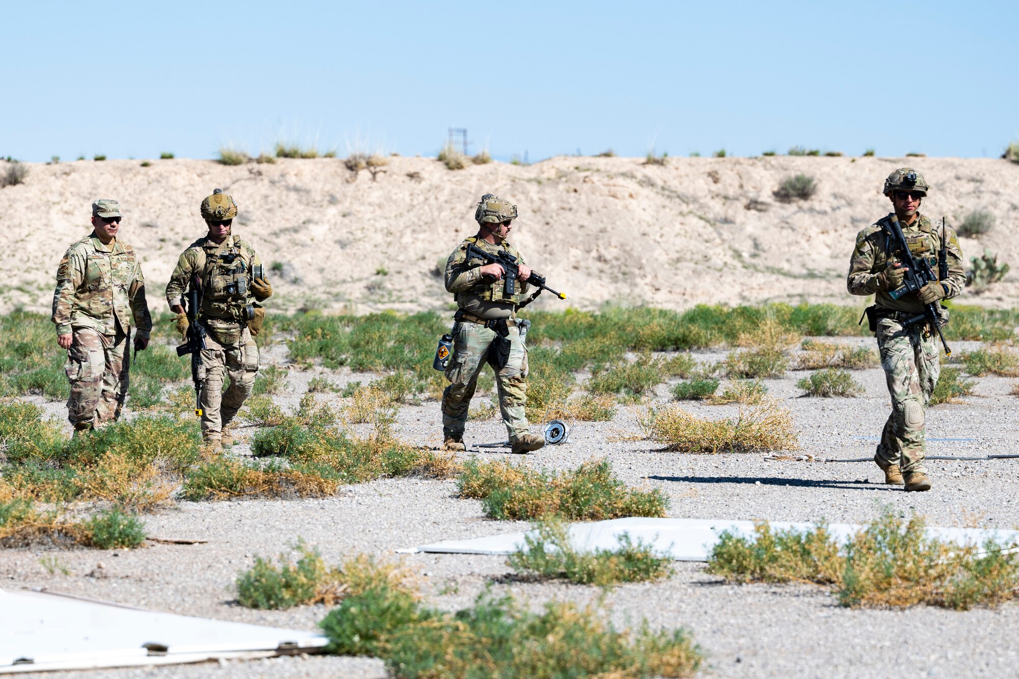 Airmen from the 49th Civil Engineer Squadron explosive ordnance disposal flight set up unexploded ordnance detonation at Holloman Air Force Base, New Mexico, Sep. 18, 2023. The EOD flight applies special techniques and procedures to lessen or remove the hazards created by the presence of unexploded ordnance. (U.S. Air Force photo by Airman 1st Class Michelle Ferrari)