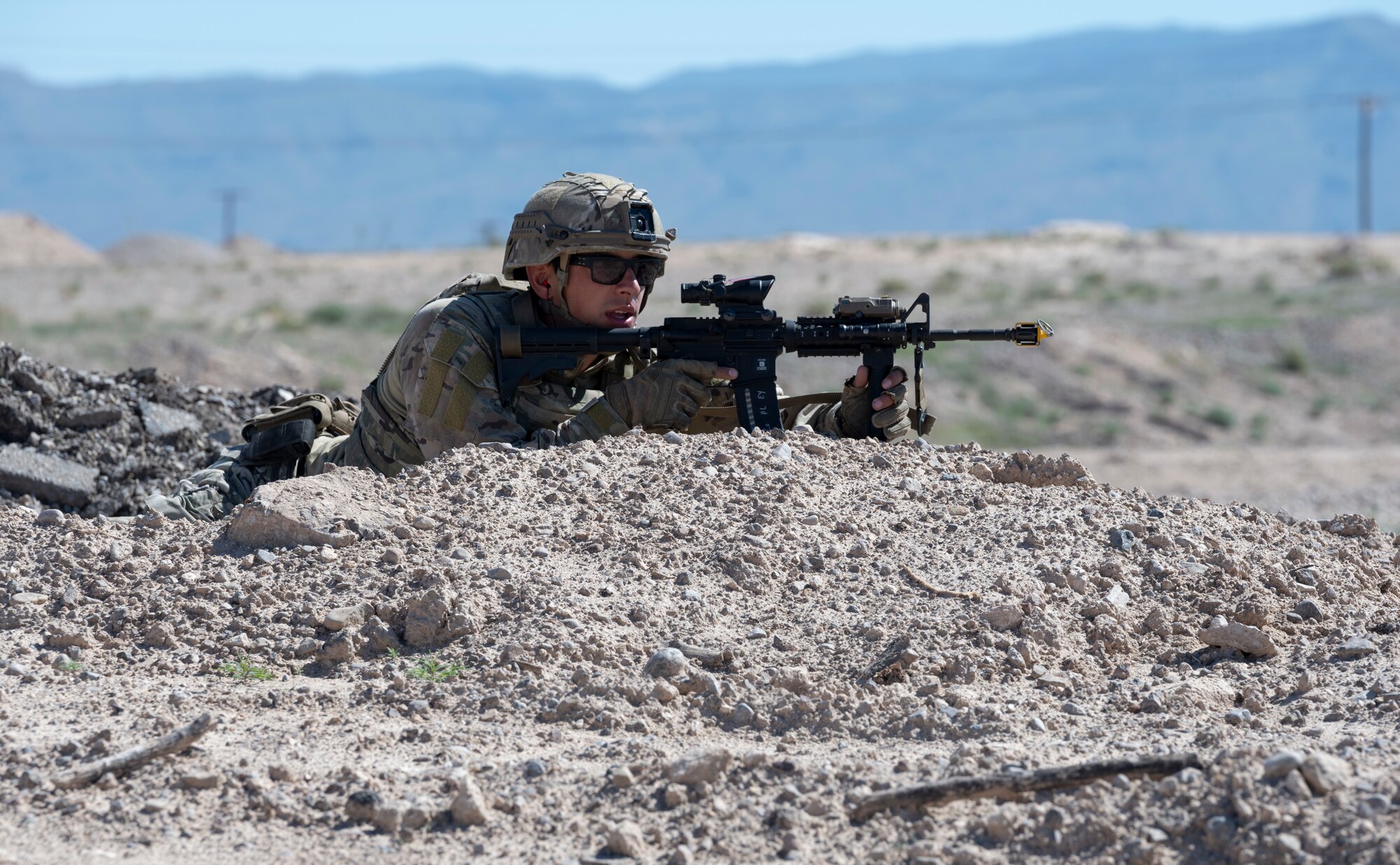 U.S. Air Force Senior Airman Tyler Copley, 49th Civil Engineer Squadron explosive ordnance disposal operations manager, holds down a position during an exercise at Holloman Air Force Base, New Mexico, Sep. 20, 2023. The EOD flight performs special tasks such as recovering the body of an enemy killed in action during a site exploitation training exercise. (U.S. Air Force photo by Airman 1st Class Michelle Ferrari)