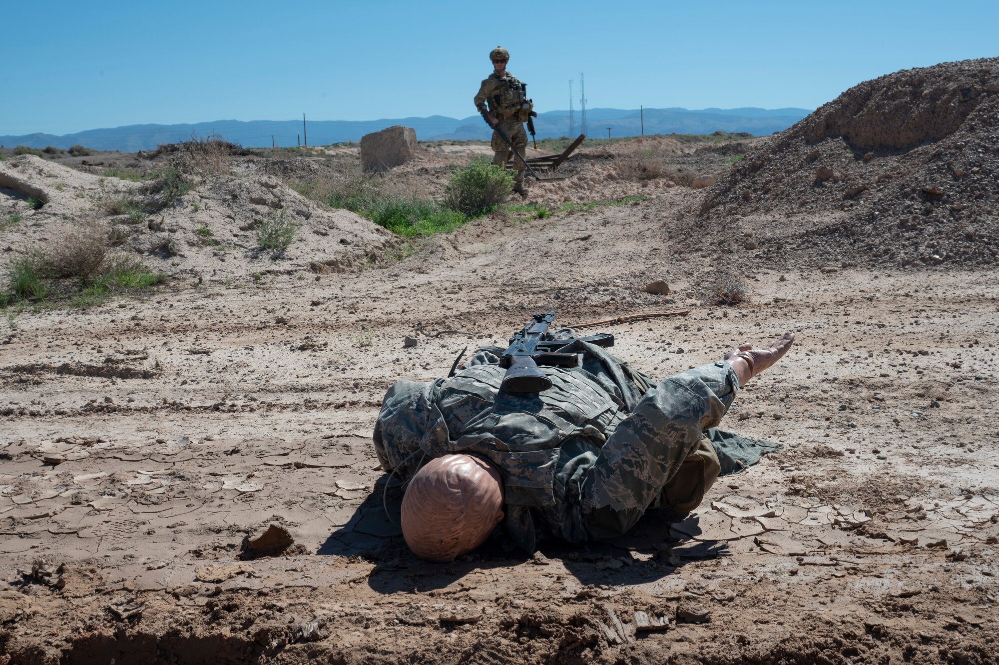 U.S. Air Force Staff Sgt. Ulysses Rogers, 49th Civil Engineer Squadron explosive ordnance disposal NCO training leader, clears a dangerous area for explosives during an exercise  at Holloman Air Force Base, New Mexico, Sep. 20, 2023. The EOD flight performs special tasks such as recovering the body of an enemy killed in action during a site exploitation training exercise. (U.S. Air Force photo by Airman 1st Class Michelle Ferrari)
