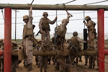 U.S. Marine Corps recruits with Echo Company, 2nd Recruit Training Battalion, navigate an obstacle during the crucible at Marine Corps Base Camp Pendleton, Calif., Sept. 26, 2023. The crucible is a 54-hour exercise where recruits apply the knowledge they learned throughout recruit training to earn the title “United States Marine.” (U.S. Marine Corps photo by Lance Cpl. Jacob B. Hutchinson)