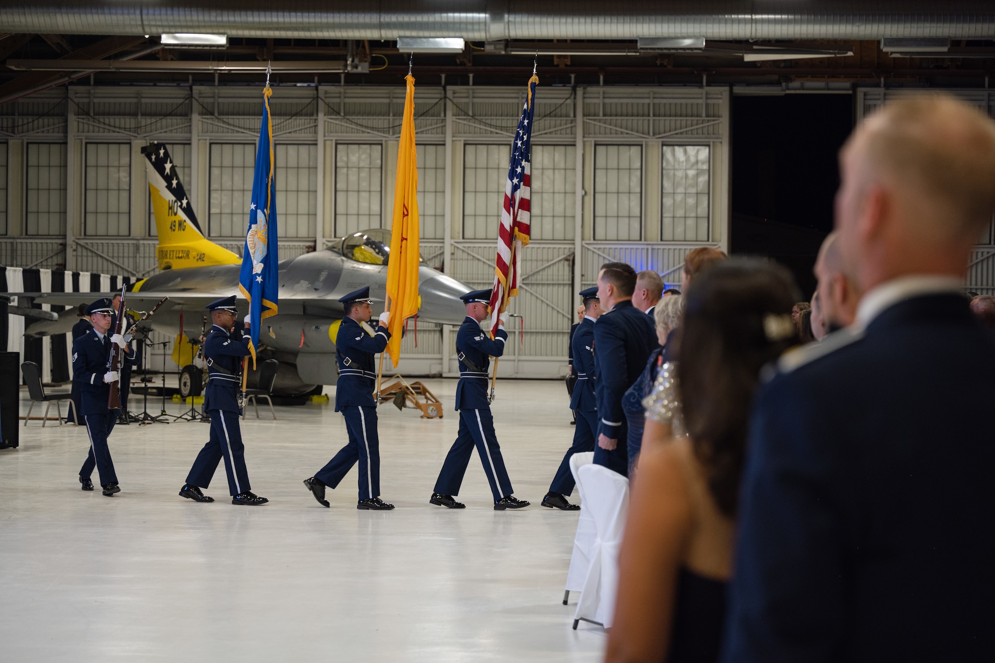 Members of the Steel Talons Honor Guard exit the floor after presenting the colors at Holloman Air Force Base, New Mexico, Sept. 23, 2023. This year’s theme for the ball was “Fightin’ 49ers… Honoring Airmen over the years” and celebrated the 76th birthday of the U.S. Air Force. (U.S. Air Force photo by Senior Airman Antonio Salfran)