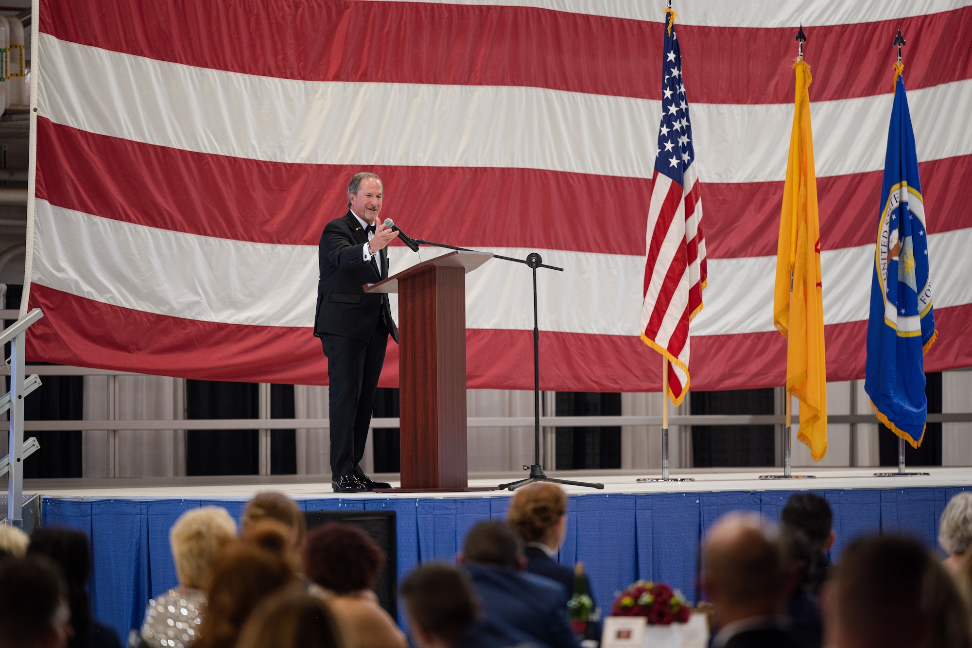 Retired U.S. Air Force Gen. David L. Goldfein gives remarks during the 2023 Holloman Air Force Ball at Holloman Air Force Base, New Mexico, Sept. 23, 2023. In June of 2006, Goldfein assumed command of the 49th Fighter Wing, which members of the current 49th Wing have decided to commemorate by having him attend the ball as the keynote speaker and naming a street in his honor. (U.S. Air Force photo by Senior Airman Antonio Salfran)
