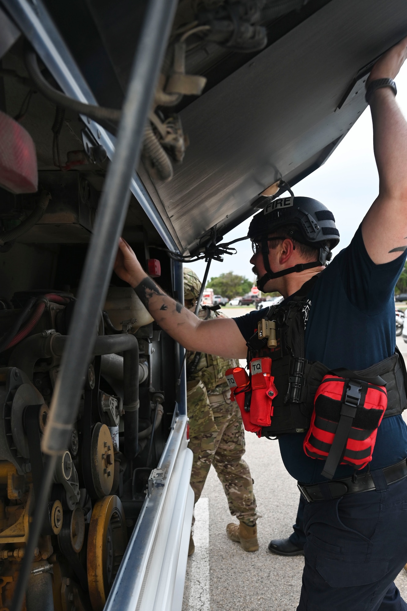 Galvin Maltais, 17th Civil Engineer Squadron firefighter, participates in an active shooter exercise during the Rescue Task Force course of the Threat Suppression Inc. exercise, Goodfellow Air Force Base, Texas, Sep. 21, 2023. This exercise simulated what would be expected of responding officers and firefighters if there was an active shooter situation on a large vehicle carrying multiple civilians. Members of the 17th Security Forces Squadron, the 17th CES fire department, and local Tom Green County Sheriff's Office officers participated in a week of classroom and practical exercises to prepare them for real world scenarios. (U.S. Air Force photo by Airman 1st Class Madison Collier)