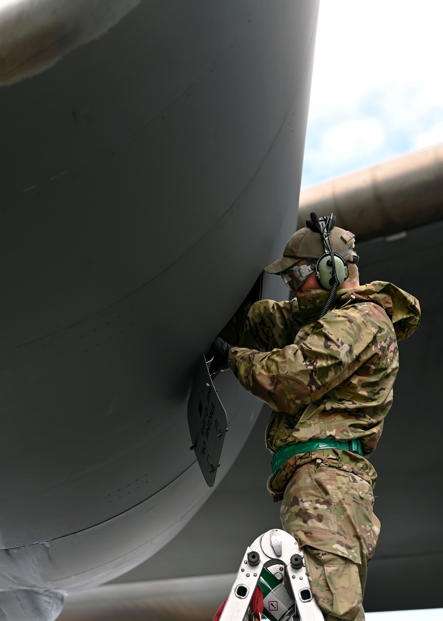 U.S. Air Force Airman 1st Class David Stanger, a crew chief with the 62d Aircraft Maintenance Squadron, services the engine oil on a C-17 Globemaster III participating in Exercise Rainier War 23A at Joint Base Lewis-McChord, Washington, Sept. 26, 2023. Rainier War is an annual exercise led by the 62d Airlift Wing designed to evaluate the ability to generate, employ and sustain in-garrison and forward deployed forces. These exercises are necessary in assessing and maintaining wartime operation tempos, ensuring command and control across multiple locations. During the exercise, Airmen will respond to scenarios that replicate today’s contingency operations and will address full-spectrum readiness against modern threats brought on by peer adversaries. (U.S. Air Force photo by Senior Airman Callie Norton)