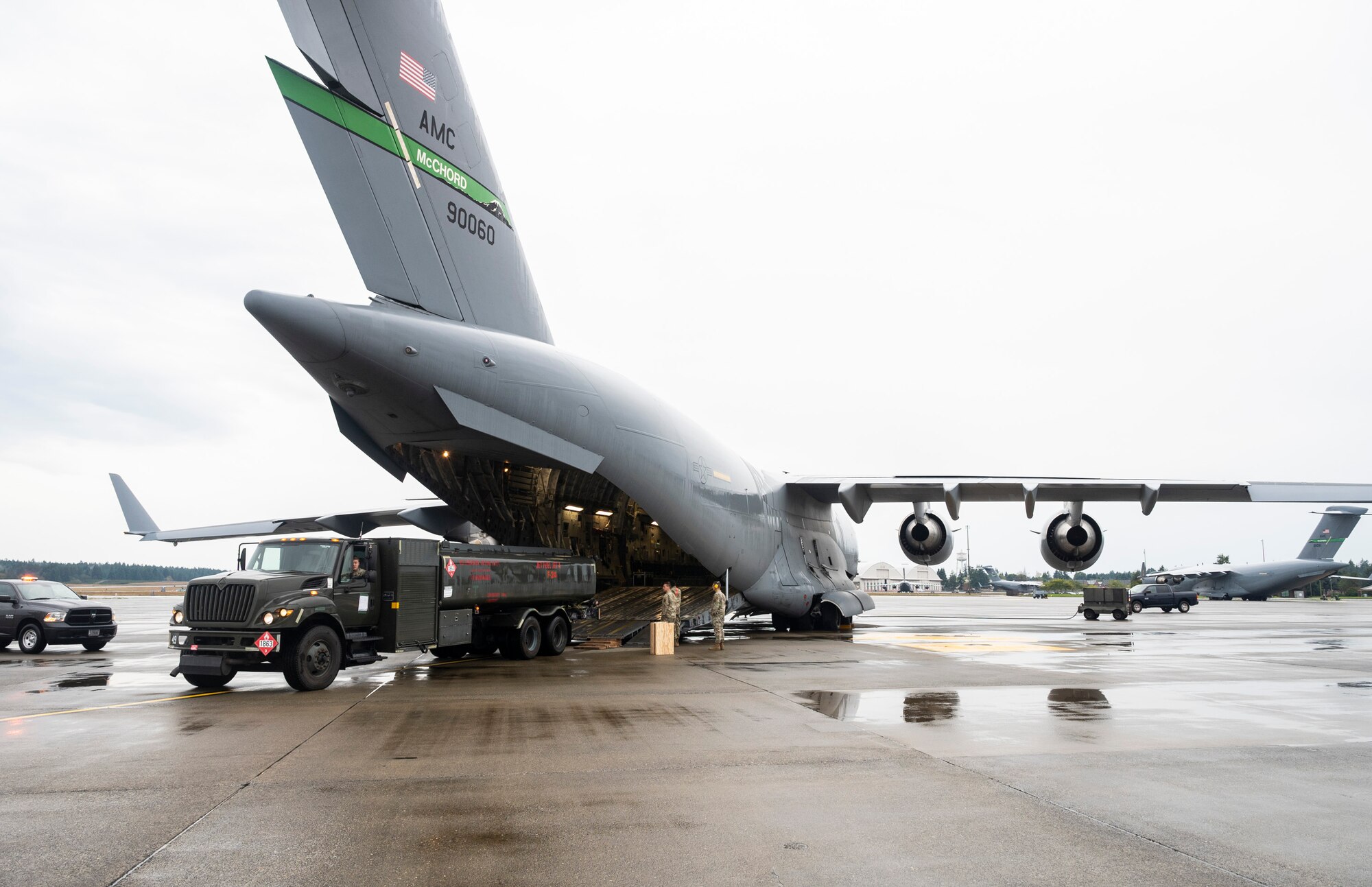 An R-11 fuel truck is loaded onto a C-17 Globemaster III during Exercise Rainier War 23A at Joint Base Lewis-McChord, Washington, Sept. 25, 2023. Rainier War is an annual exercise led by the 62d Airlift Wing designed to evaluate the ability to generate, employ and sustain in-garrison and forward deployed forces. These exercises are necessary in assessing and maintaining wartime operational tempos, ensuring command and control across multiple locations. During the exercise, Airmen will respond to scenarios that replicate today’s contingency operations and will address full-spectrum readiness against modern threats brought on by peer adversaries. (U.S. Air Force photo by Staff Sgt. Rachel Williams)