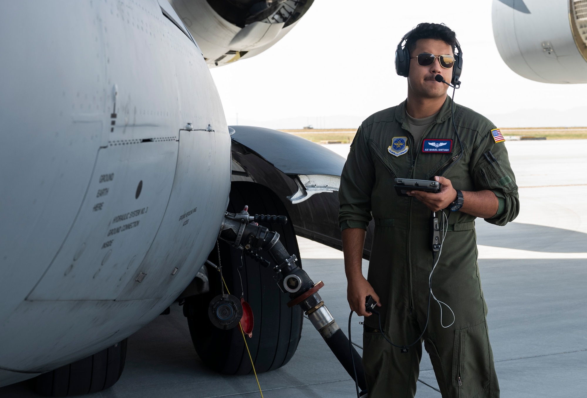 U.S. Air Force Airman 1st Class Manuel Santiago, a loadmaster with the 4th Airlift Squadron, reviews a checklist while performing specialized fueling operations during Exercise Rainier War 23A at Mountain Home Air Force Base, Idaho, Sept. 25, 2023. Rainier War is an annual exercise led by the 62d Airlift Wing designed to evaluate the ability to generate, employ and sustain in-garrison and forward deployed forces. These exercises are necessary in assessing and maintaining wartime operational tempos, ensuring command and control across multiple locations. During the exercise, Airmen will respond to scenarios that replicate today’s contingency operations and will address full-spectrum readiness against modern threats brought on by peer adversaries. (U.S. Air Force photo by Staff Sgt. Rachel Williams)