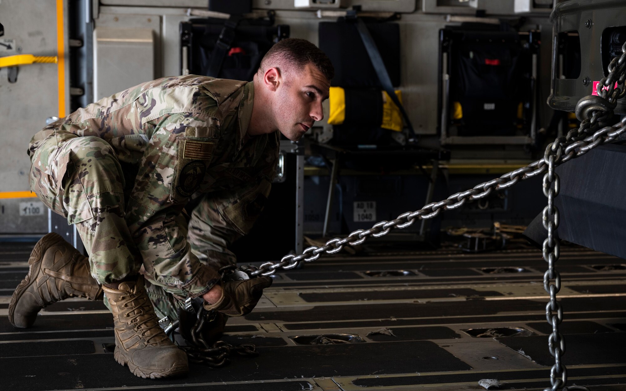 U.S. Air Force Staff Sgt. Weston Izzi, ramp operations with the 627th Aerial Port Squadron, secures an R-11 fuel truck on a C-17 Globemaster III during Exercise Rainier War 23A at Mountain Home Air Force Base, Idaho, Sept. 25, 2023. Rainier War is an annual exercise led by the 62d Airlift Wing designed to evaluate the ability to generate, employ and sustain in-garrison and forward deployed forces. These exercises are necessary in assessing and maintaining wartime operational tempos, ensuring command and control across multiple locations. During the exercise, Airmen will respond to scenarios that replicate today’s contingency operations and will address full-spectrum readiness against modern threats brought on by peer adversaries. (U.S. Air Force photo by Staff Sgt. Rachel Williams)
