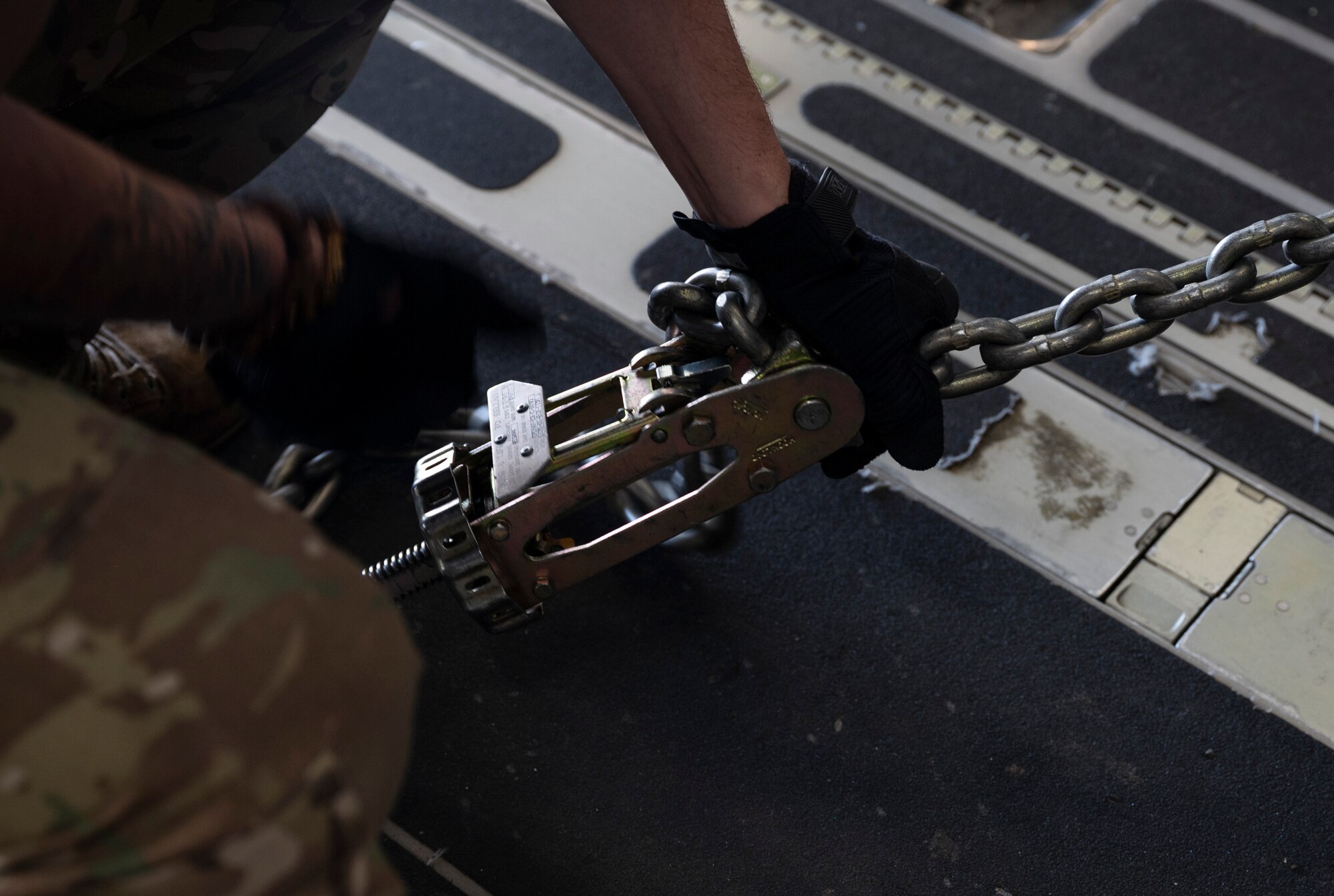 U.S. Air Force Senior Airman Kainoa Cook, a loadmaster with the 4th Airlift Squadron, secures an R-11 fuel truck on a C-17 Globemaster III during Exercise Rainier War 23A at Mountain Home Air Force Base, Idaho, Sept. 25, 2023. Rainier War is an annual exercise led by the 62d Airlift Wing designed to evaluate the ability to generate, employ and sustain in-garrison and forward deployed forces. These exercises are necessary in assessing and maintaining wartime operational tempos, ensuring command and control across multiple locations. During the exercise, Airmen will respond to scenarios that replicate today’s contingency operations and will address full-spectrum readiness against modern threats brought on by peer adversaries. (U.S. Air Force photo by Staff Sgt. Rachel Williams)