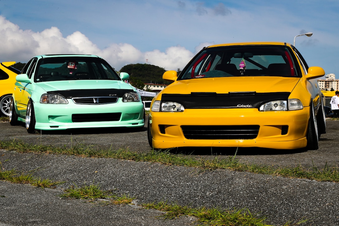 Customized Honda Civics on display during the Camp Foster Food Truck Fair and Car Show on Camp Foster, Okinawa, Japan, Aug 19. 2023. Camp Foster hosted food trucks, musical performances and a car show for civilians and Status of Forces Agreement personnel. (U.S. Marine Corps photo by Cpl. Zachary Sarvey)