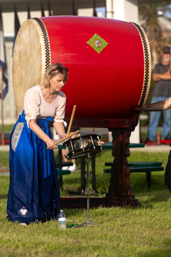 Susanne Wall, a music teacher at Kubasaki High School, plays the drums during a Ringing of the Bell ceremony at Kubasaki High School on Camp Foster, Okinawa, Japan, Aug. 21, 2023. To welcome back students on the first day of school, Kubasaki High School held a ceremony that featured Taiko drums that were donated by Yoshinori Arakaki. 

“I donated these drums as a gift because I heard that Kubasaki High School has a drum class, and I wanted them to learn more about Japanese culture,” said Arakaki. “I was so thrilled to see so many students appreciate the Taiko drums and welcome me to their school on such a large scale.”  

Arakaki was born in Yomitan Village, Okinawa in 1941. From 1962 to 1972 he worked at White Beach for ten years as a bartender. Since 1978, he has run a Sanshin shop and owns a factory in Vietnam where he stores Taiko drums.