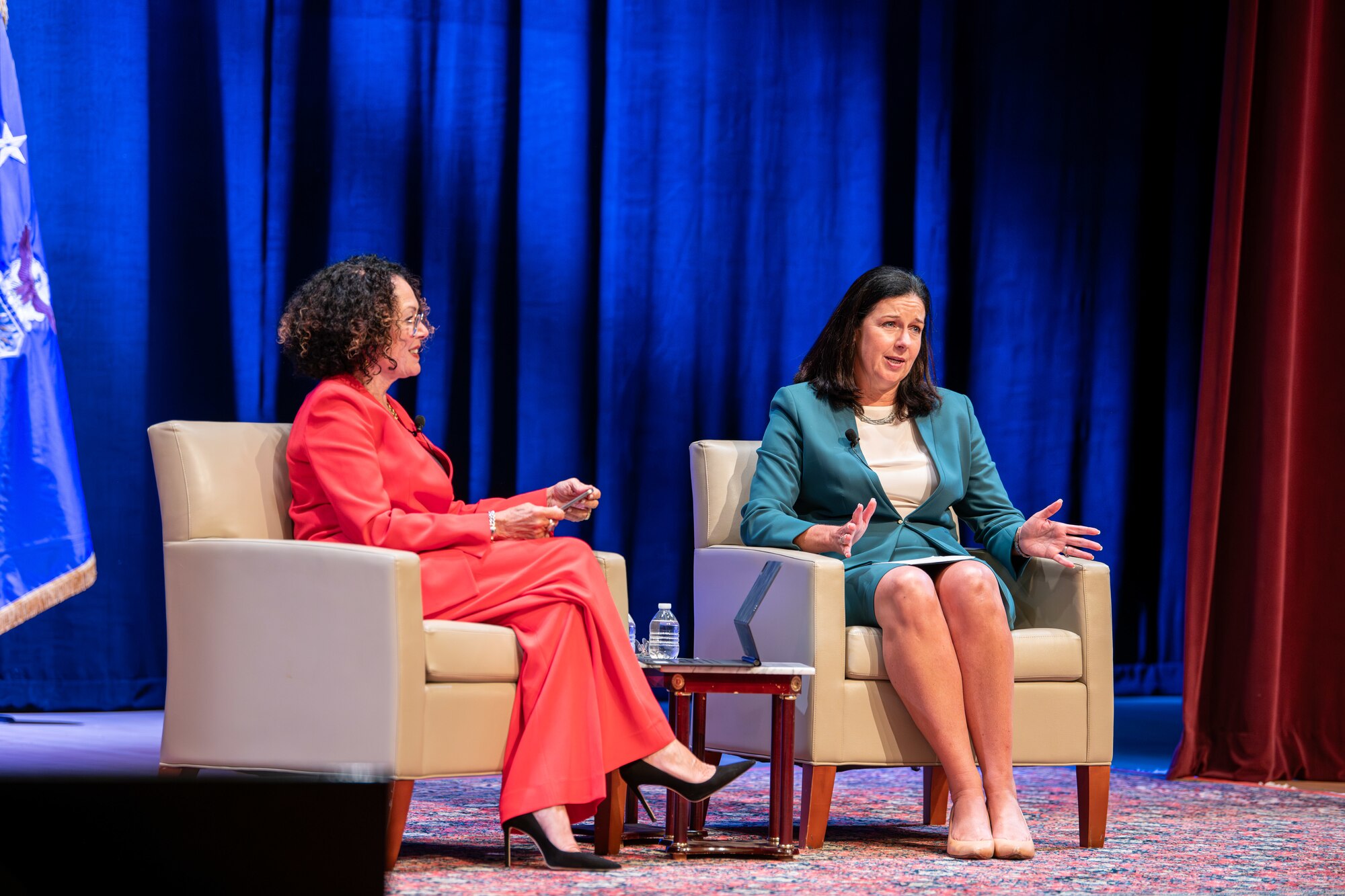 Marianne Malizia, Secretary of the Air Force Diversity and Inclusion director and Kristyn Jones, assistant secretary of the Air Force for Financial Management and Comptroller, performing the duties of Under Secretary of the Air Force, talks with audience members during a Q and A session during the Department of the Air Force Diversity, Equity, Inclusion and Accessibility Conference Sept. 18-20, 2023 at The George Washington University in Washington, D.C. This year's conference theme was "Respect, Recruit, Retain and Ready," which aimed to empower all Airmen and Guardians, and emphasized the need for inclusive leadership, trust and a sense of belonging amid an evolving battlefield. (U.S. Air Force photo by Capt. Shane Ellis)