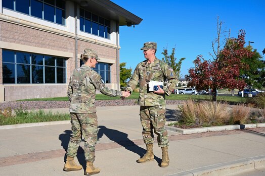  CMSgt Lloyd shakes hands with Col Dexter