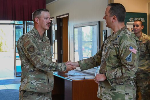  CMSgt Lloyd shakes hands with TSgt. Braaten