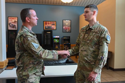  CMSgt. Lloyd shakes hands with SrA Burge