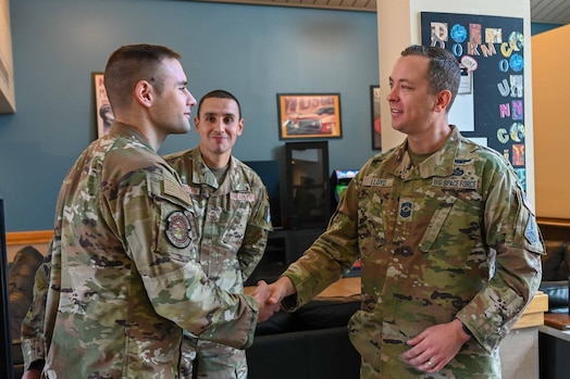  CMSgt Lloyd shakes hands with SSgt Brady