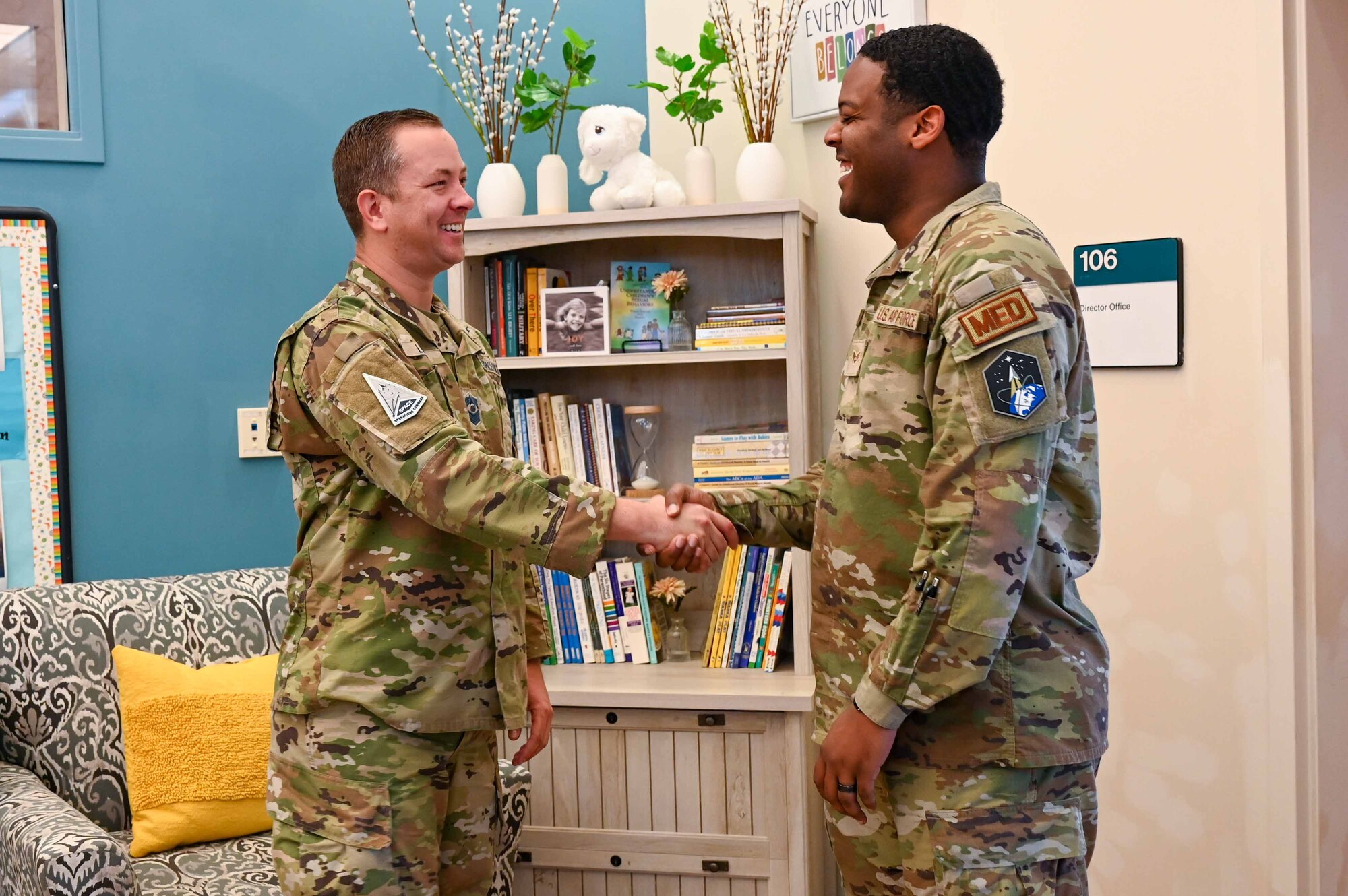 CMSgt Lloyd shakes hands with SrA Berry