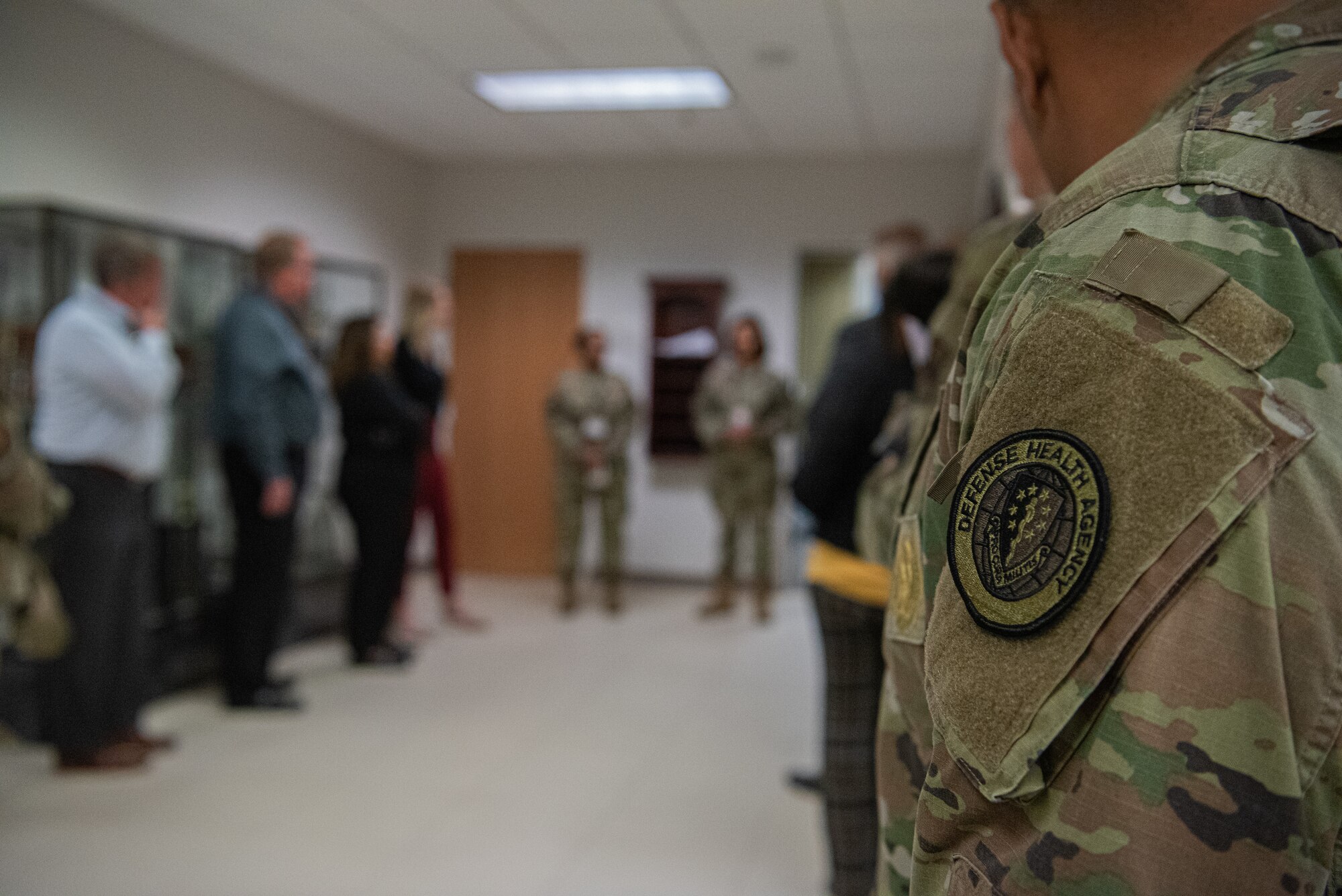 A representative of the Defense Health Agency receives a mission brief from members of the 27th Medical Group