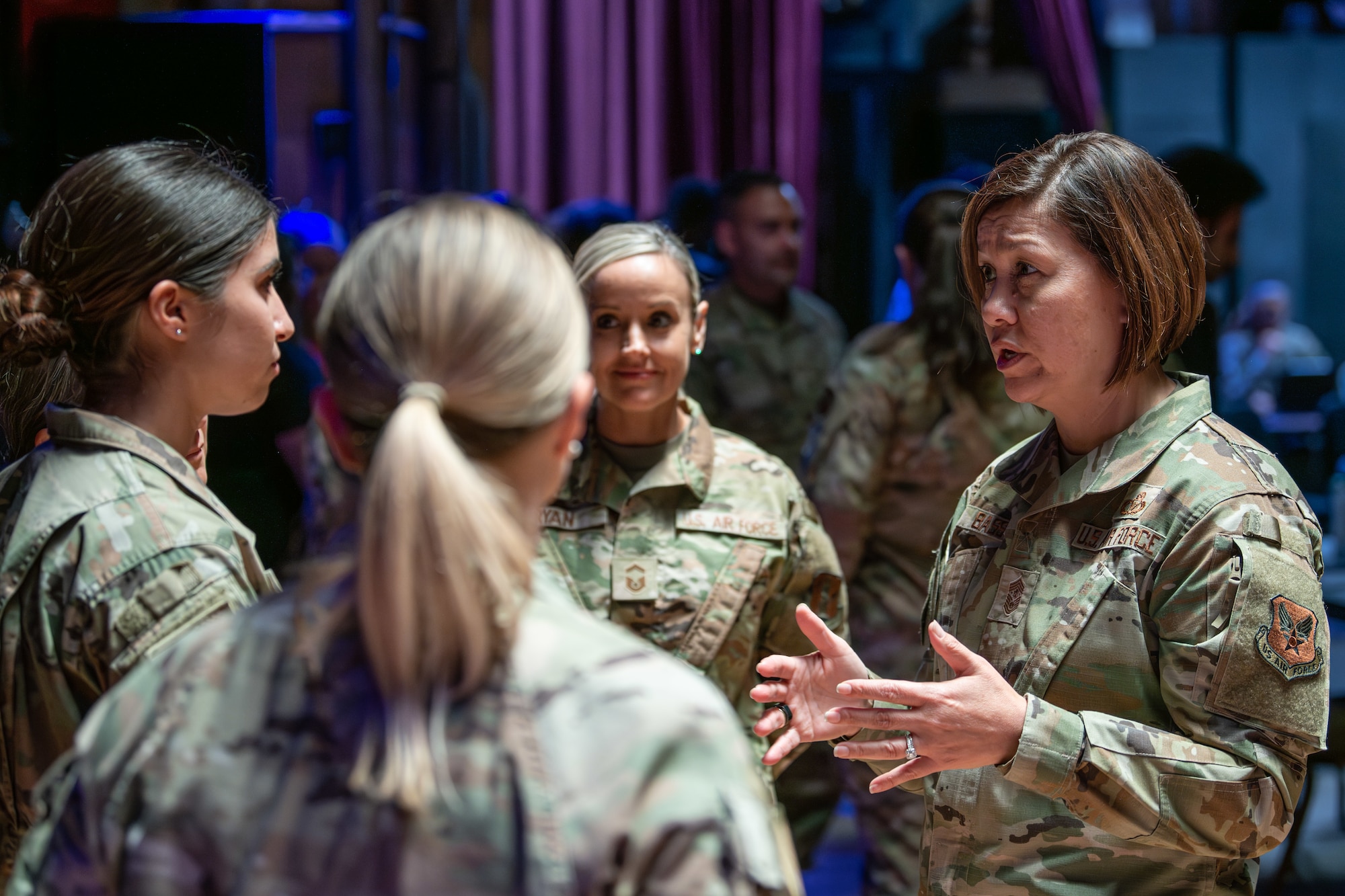 Chief Master Sgt. of the Air Force JoAnne S. Bass provides a mentoring session backstage during the Department of the Air Force Diversity, Equity, Inclusion and Accessibility Conference Sept. 18-20, 2023 at The George Washington University in Washington, D.C. This year's conference theme was "Respect, Recruit, Retain and Ready," which aimed to empower all Airmen and Guardians. (U.S. Air Force photo by Capt. Shane Ellis)