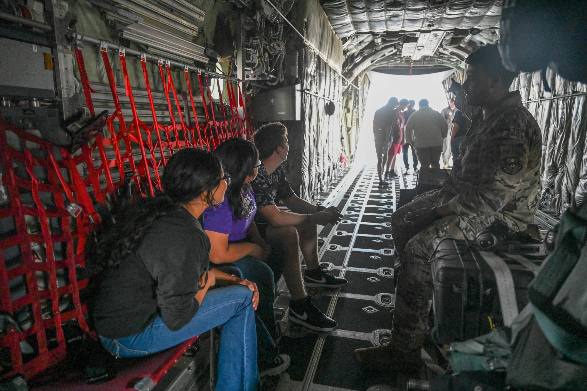 People sit inside an aircraft.