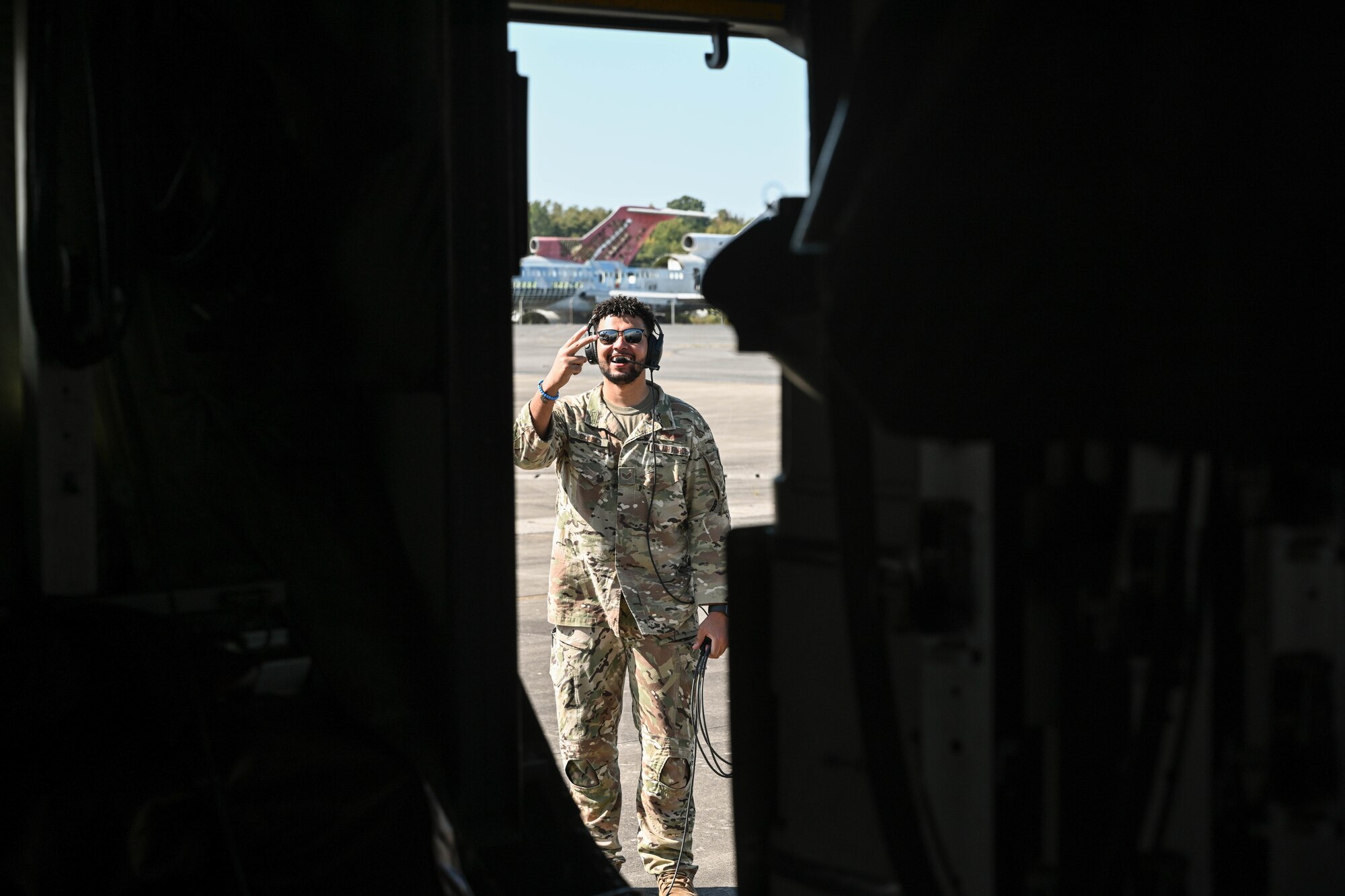 An Airman stands in a doorway.