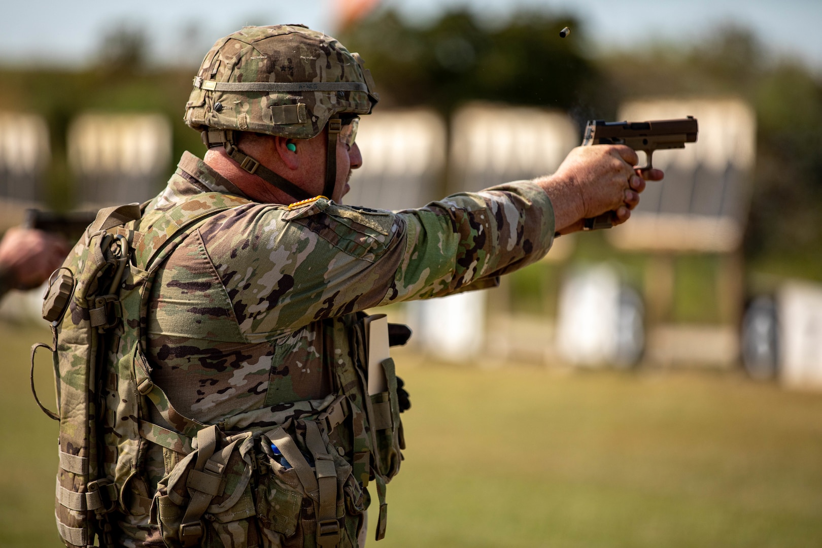 Sgt. Shawn Green, a Soldier with the 1st Squadron, 180th Cavalry Regiment, 45th Infantry Brigade Combat Team, Oklahoma Army National Guard, demonstrates his marksmanship during the Sergeant Major’s Match and Governor’s Twenty Marksmanship Competition with his M17 pistol at Camp Gruber Training Center, Oklahoma, Sept. 14, 2023. The Sergeant Major’s Match and Governor’s Twenty bring together Soldiers from across the state and test their weapons skills to earn the coveted Governor’s Twenty tab. (Oklahoma National Guard photo by Spc. Tyler Brahic).