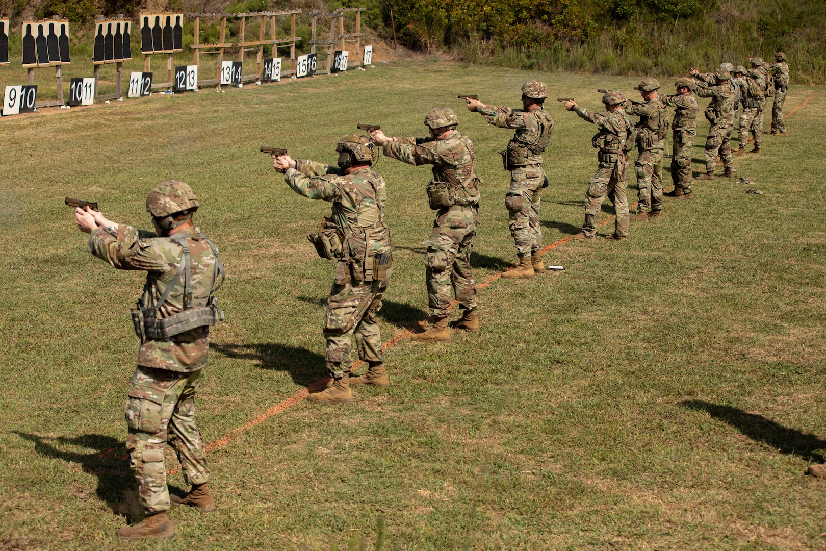 Oklahoma Army National Guard Soldiers fire at silhouette targets during the Sergeant Major’s Match and Governor’s Twenty Marksmanship Competition with their M17 pistols at Camp Gruber Training Center, Oklahoma, Sept. 14, 2023. The Sergeant Major’s Match and Governor’s Twenty bring together Soldiers from across the state and test their weapons skills to earn the coveted Governor’s Twenty tab. (Oklahoma National Guard photo by Spc. Tyler Brahic).