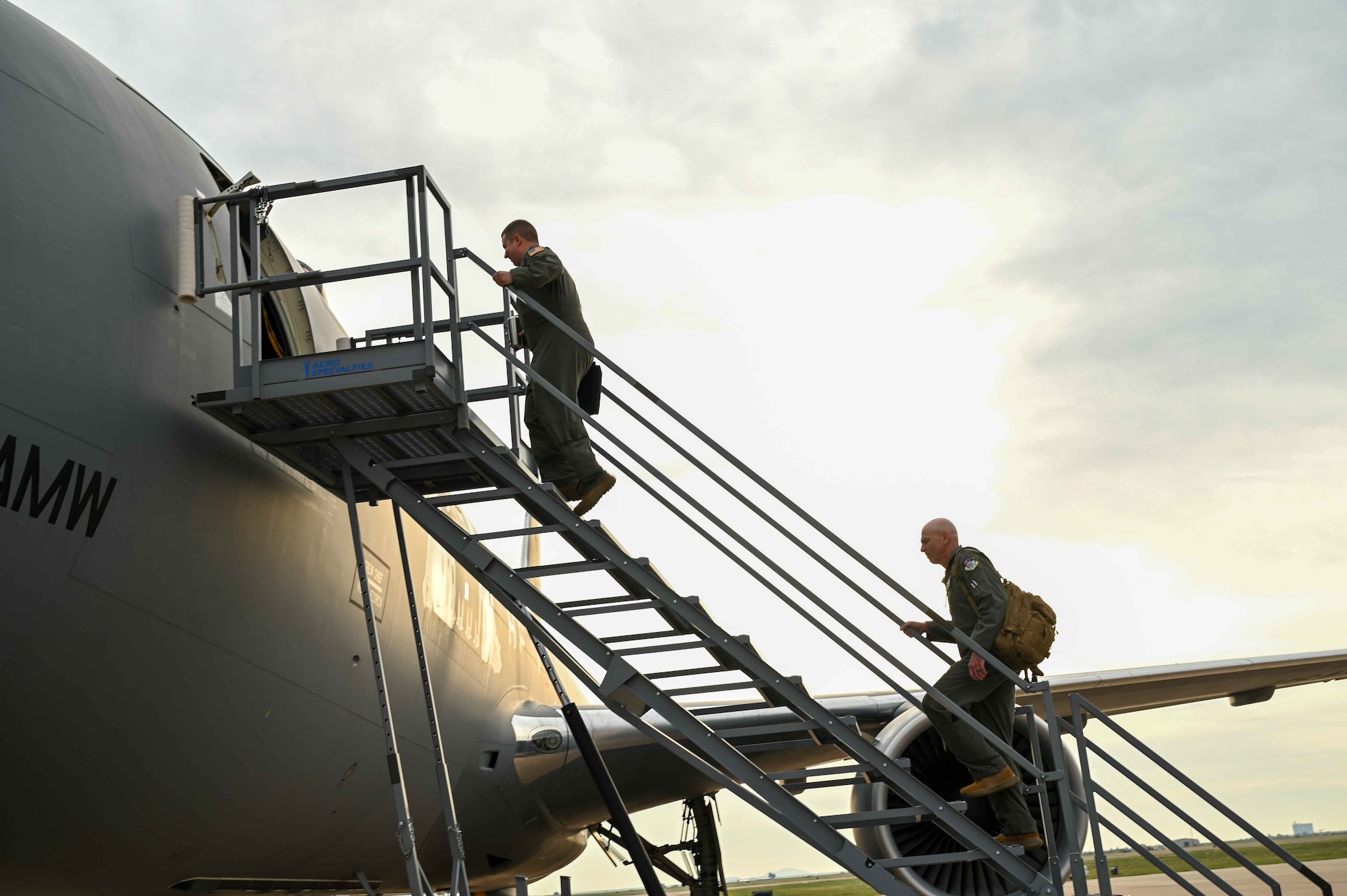 U.S. Air Force Maj. Gen. Clark Quinn follows Lt. Col. Pete Culbert, 56th Air Refueling Squadron commander, onto a KC-46 Pegasus at Altus Air Force Base, Oklahoma, Sept. 21, 2023. The KC-46 can accommodate a mixed load of passengers, aeromedical evacuation, and cargo capabilities. (U.S. Air Force photo by Airman 1st Class Kari Degraffenreed)