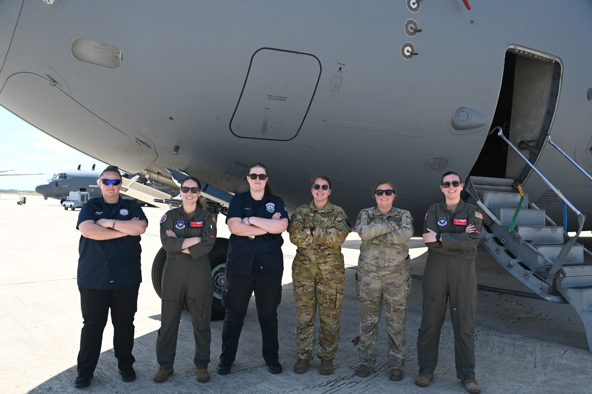 Aircrew from the 97th Air Mobility Wing gather for a photo in front of a C-17 Globemaster III at the Torch Athena Fly-In held in San Antonio Texas, Sept. 21, 2023. The event gave attendees an opportunity to experience diverse aviation career fields and empowered all women to be the best versions of themselves. (U.S. Air Force photo by Airman 1st Class Heidi Bucins)