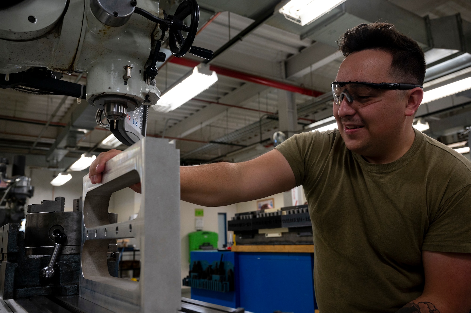 Man arranges part on machine