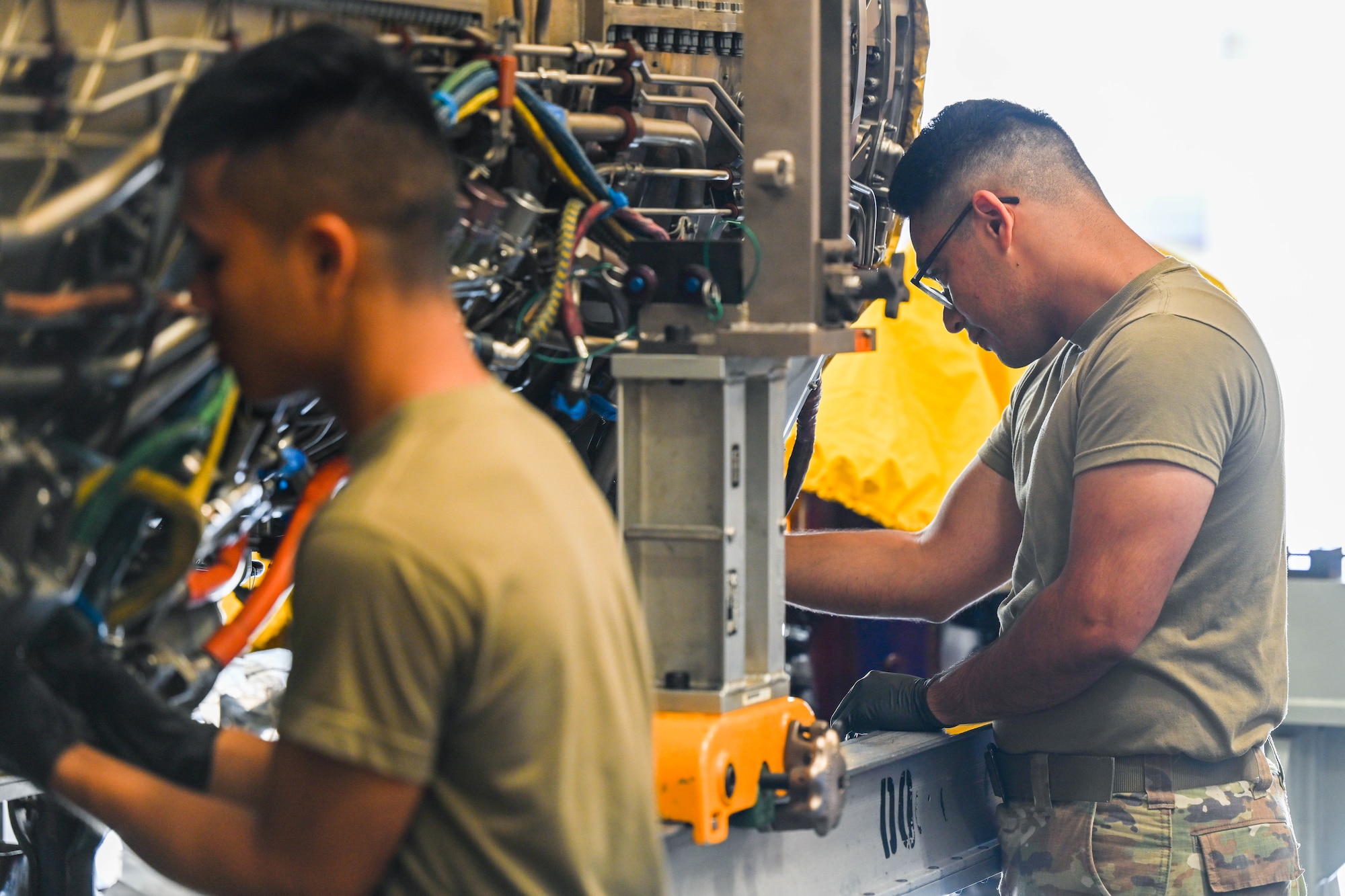 Airman 1st Class Mota Miquesias, 15th Maintenance Squadron aerospace propulsion journeyman, works on an engine of an F-22 Raptor at Joint Base Pearl Harbor-Hickam, Hawaii, August 2, 2023. The 15th MXS aerospace propulsion flight’s mission is to maintain upkeep and perform routine maintenance on the F-22 Raptor engine. (U.S. Air Force photo by Senior Airman Makensie Cooper)