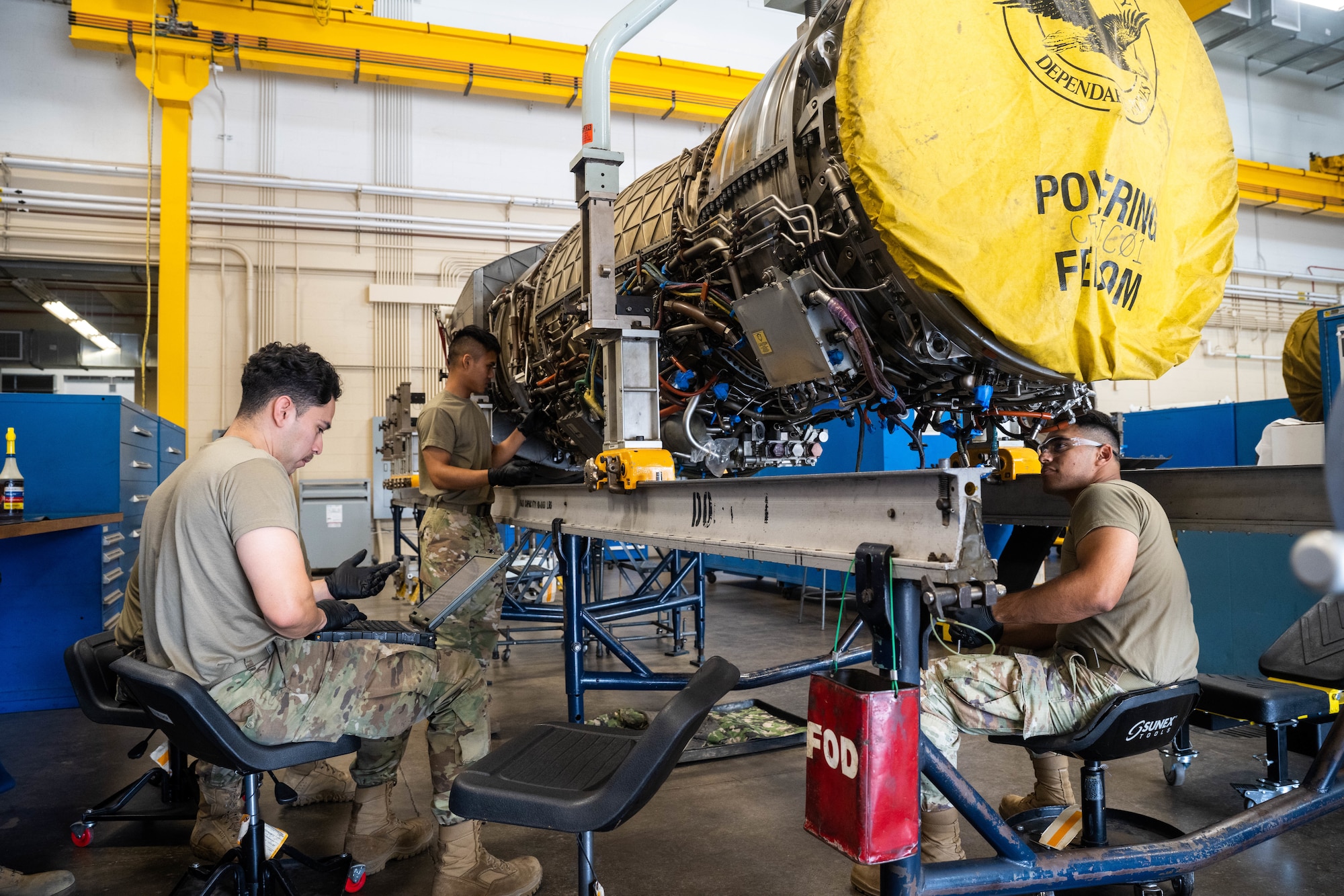 Airmen from the 15th Maintenance Squadron Propulsion flight work on an F-22 Raptor engine at Joint Base Pearl Harbor-Hickam, Hawaii Aug. 2, 2023. The MXS maintainers performed routine maintenance on the engine and checked it for any discrepancies during a quality-control check. (U.S. Air Force photo by Senior Airman Makensie Cooper)