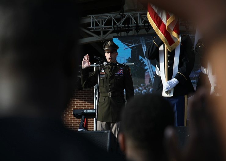 Maj. Gen. Paul Stanton, Commanding General, Cyber Center of Excellence, provides the oath of office for new Army recruits at Thunder Over Evans, a celebration of our Armed Forces.