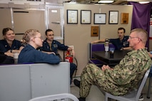 Vice Admiral Wolfe talks to sailors sitting in a group aboard the  Ohio-class ballistic missile submarine USS Louisiana (SSBN 743) during Demonstration and Shakedown Operation-32 (DASO-32) in the Pacific Ocean.