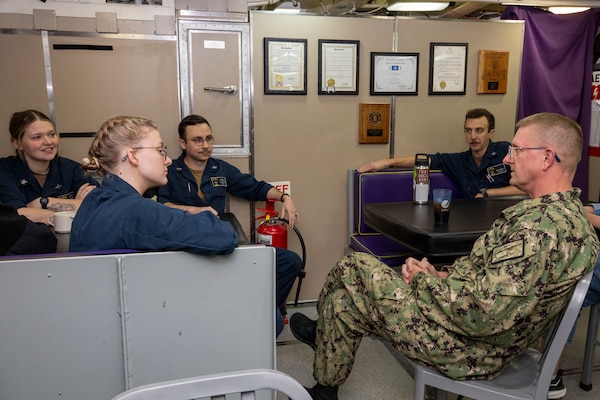 Vice Admiral Wolfe talks to sailors sitting in a group aboard the  Ohio-class ballistic missile submarine USS Louisiana (SSBN 743) during Demonstration and Shakedown Operation-32 (DASO-32) in the Pacific Ocean.