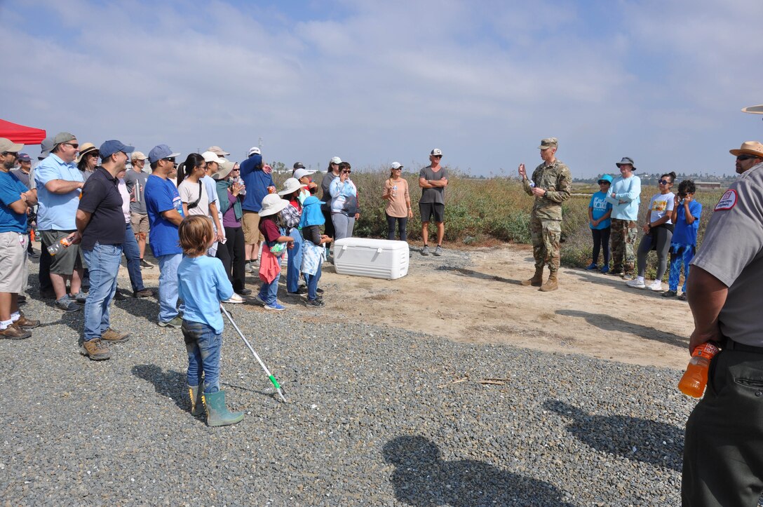 Col. Andrew Baker addresses volunteers, Sept. 23, in Newport Beach, Calif, for their contribution to National Public Lands Day.