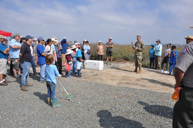 Col. Andrew Baker addresses volunteers, Sept. 23, in Newport Beach, Calif, for their contribution to National Public Lands Day.