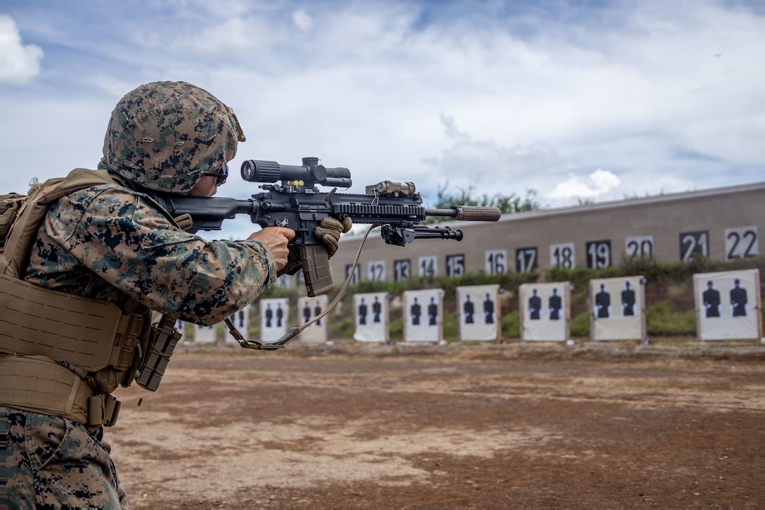 U.S. Marine Corps Cpl. Antonio Keifner, a rifleman with Bravo Company, 3rd Littoral Combat Team, 3rd Marine Littoral Regiment, 3rd Marine Division, fires a suppressed M27 Infantry Automatic Rifle during a range acoustic test at Pu'uloa Range Training Facility, Marine Corps Base Hawaii, Sept. 19, 2023. MCBH's Safety Department and PRTF personnel conducted the acoustic test to record and determine the effectiveness of suppressed weapons at reducing noise pollution exiting PRTF. (U.S. Marine Corps photo by Lance Cpl. Hunter J. Jones)