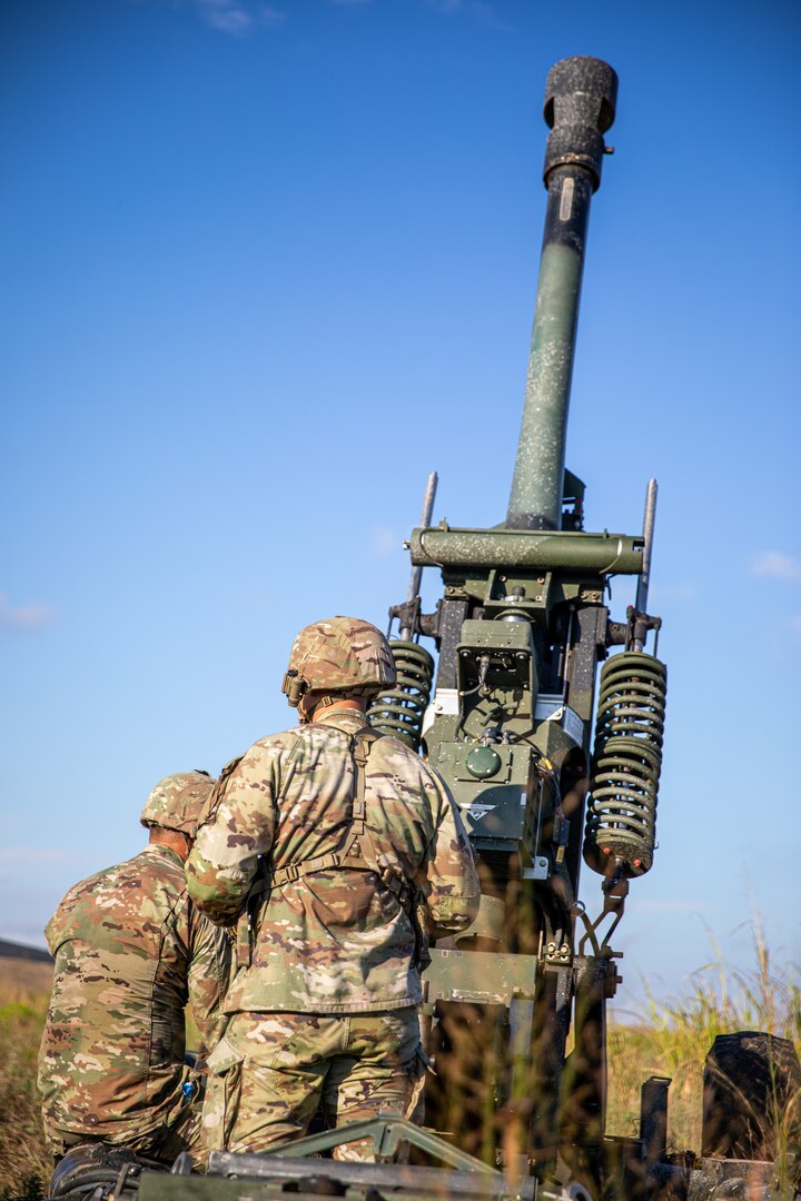 Oklahoma Army National Guard Soldiers assigned to the 1st Battalion, 160th Field Artillery Regiment, 45th Infantry Brigade Combat Team, place a 105 mm shell into a howitzer during a live-fire training exercise at Fort Sill, Oklahoma, Sept. 15, 2023. The exercise allows Soldiers to hone their proficiency in swiftly executing fire missions, loading and firing shells within strict time constraints and replicating the intensity of real-world operations. (Oklahoma National Guard photo by Spc. Danielle Rayon)