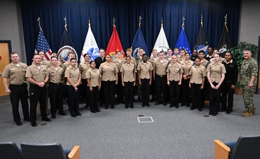 DAHLGREN, Va. (Sept. 25, 2023) Cadets and instructors from Stafford High School’s Navy Junior Reserve Officer's Training Corps pose for a group photo with Surface Combat Systems Training Command (SCSTC) leadership, SCSTC AEGIS Training and Readiness Center leadership, and staff from Navy Talent Acquisition Group Richmond during their visit to Naval Support Facility Dahlgren, Sept. 25. Twenty-four cadets visited as part of an effort to help potential future warfighters learn more about the different careers and opportunities found in the U.S. Navy. (U.S. Navy photo by Michael Bova)