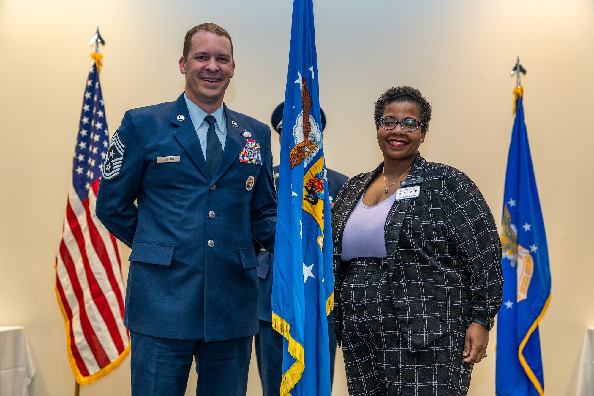U.S. Air Force Chief Master Sgt. Michael Venning, 81st Training Wing, command chief, poses with Ms. LaWanda Jones, Mississippi Gulf Coast Chamber of Commerce, director, during the Honorary Commander Induction Ceremony at Keesler Air Force Base, Mississippi, Sept. 22, 2023.