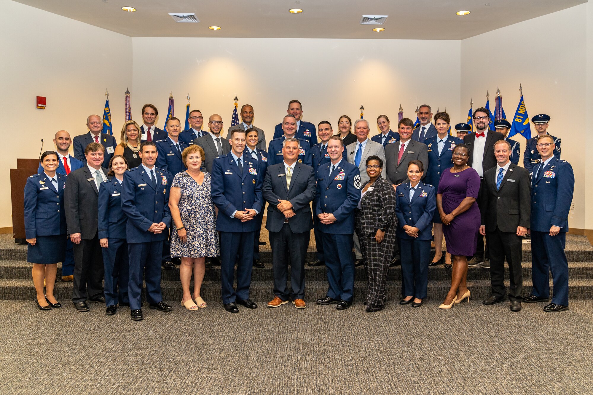 U.S. Air Force commanders, chiefs and their honorary commanders pose for a group photo during the Honorary Commander Induction Ceremony at Keesler Air Force Base, Mississippi, Sept. 22, 2023.