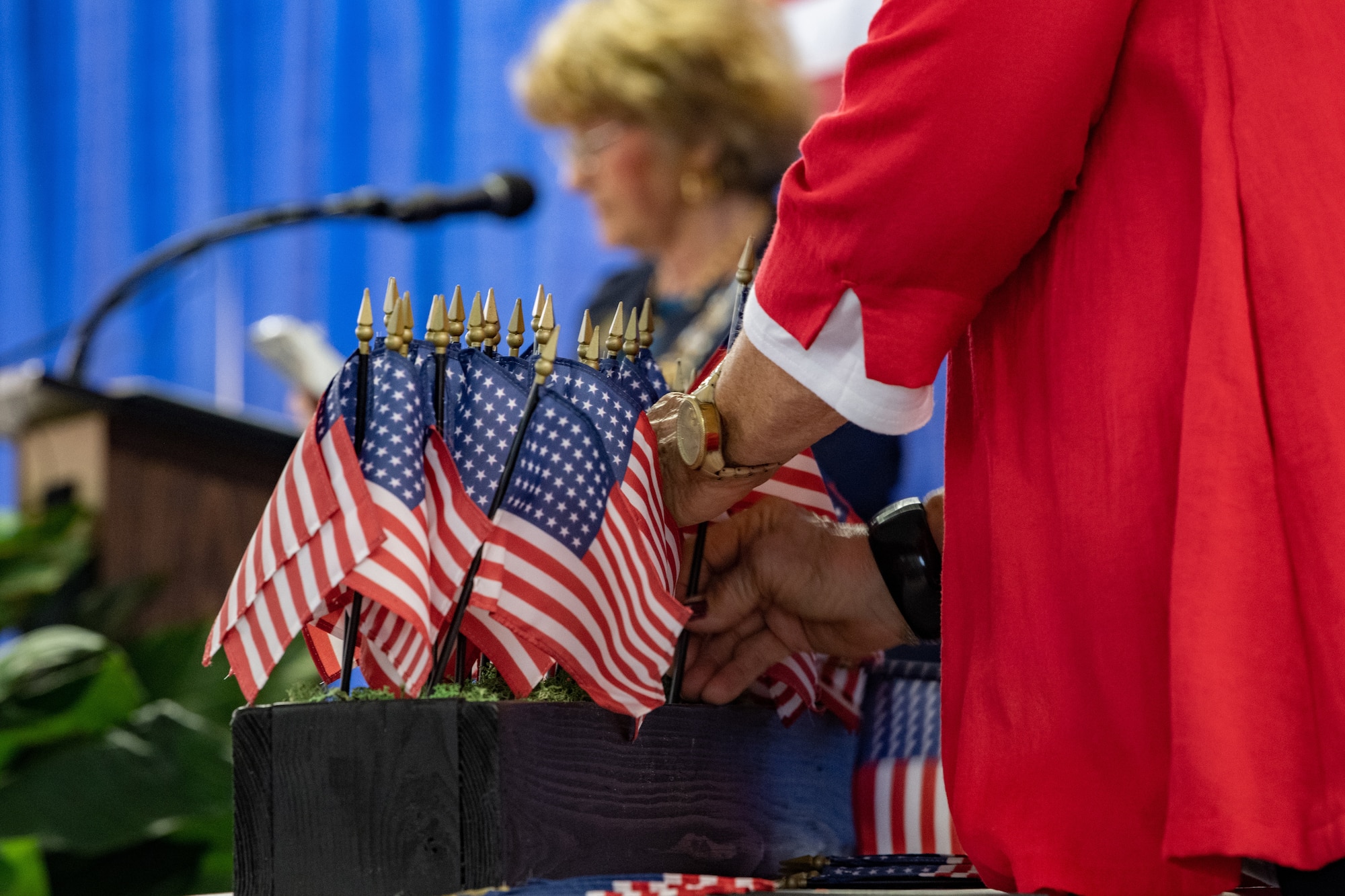 Event coordinators placed individual flags as names of fallen Army Air Forces Airmen were read aloud during a memorial ceremony at Spence Field in Moultrie, Georgia, Sept. 26, 2023. The event was organized by the John Benning Chapter of the Daughters of the American Revolution, the City of Moultrie and Colquitt County. (U.S. Air Force photo by Senior Airman Courtney Sebastianelli)