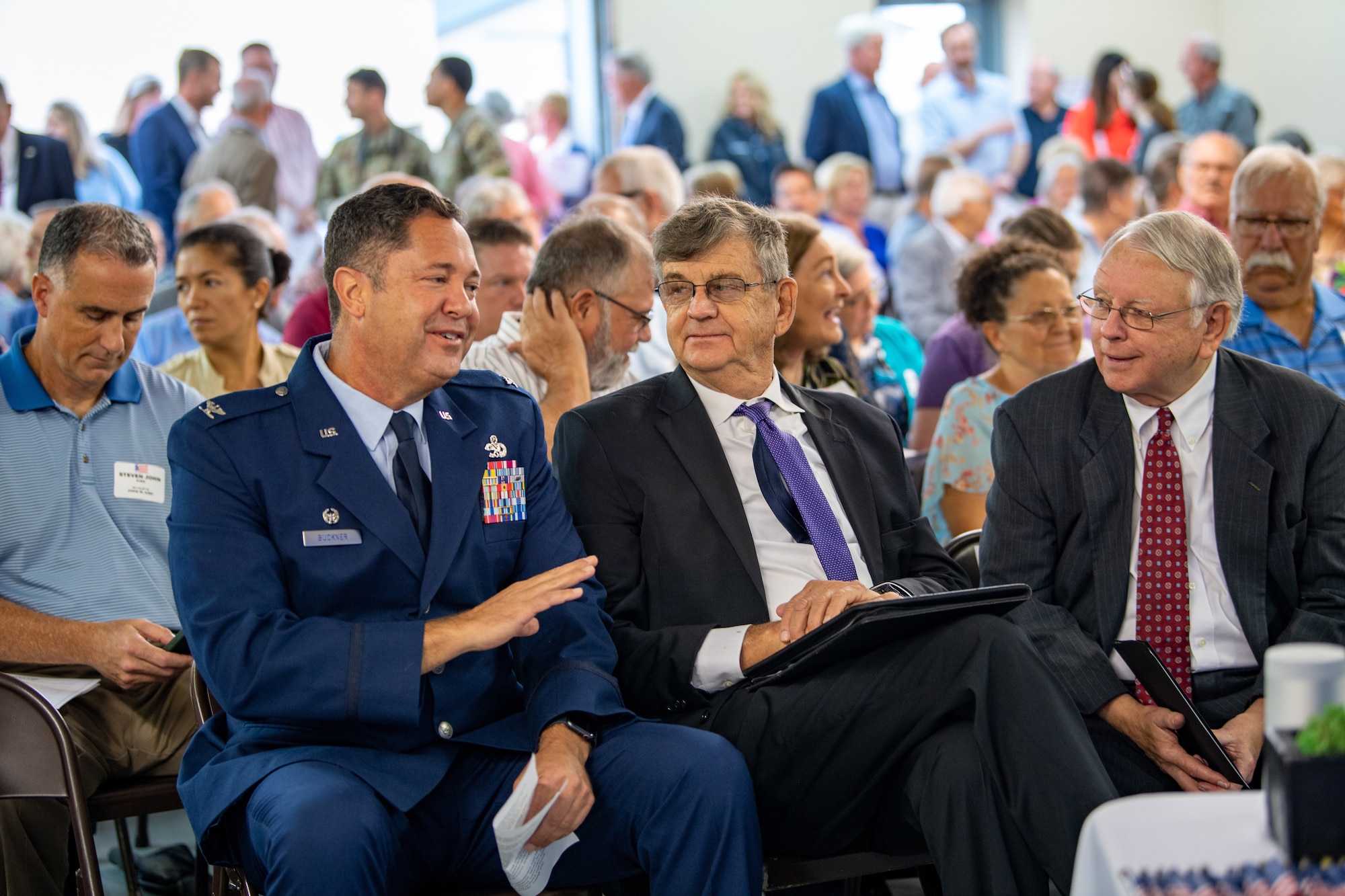 U.S. Air Force Col. Bobby Buckner, 23rd Maintenance Group commander, talks with community leaders at Spence Field in Moultrie, Georgia, Sept. 26, 2023. Airmen from Moody Air Force Base joined the families and community members to honor the 62 Airmen who lost their lives while training at Spence Field between 1942 and 1945. (U.S. Air Force photo by Senior Airman Courtney Sebastianelli)