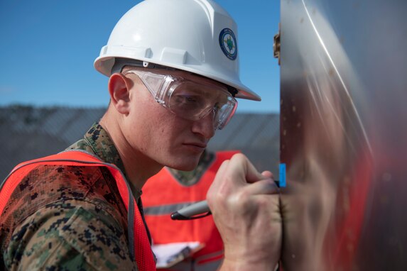 Joint Task Force-Red Hill (JTF-RH) communications directorate team member, U.S. Marine Corps Cpl. Connor Jones, conducts tamper seal checks as a safety measure in preparation for defueling operations on Joint Base Pearl Harbor-Hickam, Hawaii, Sept. 26, 2023. JTF-RH is in phase four of its five-phase defueling plan where personnel are focused on completion of pre-defueling material assessments, continued training and rehearsals, routine maintenance actions, and quality assurance and safety checks. This is the final preparatory stage prior to commencement of gravity defueling on Oct. 16 and marks the final coordination with the Department of Defense, Environmental Protection Agency, and Hawaii Department of Health before approval to defuel is received. (DoD photo by U.S. Navy Mass Communication Specialist 1st Class Jordan KirkJohnson)