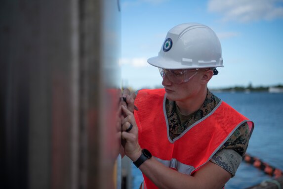 Joint Task Force-Red Hill (JTF-RH) communications directorate team member, U.S. Marine Corps Cpl. Connor Jones, conducts tamper seal checks as a safety measure in preparation for defueling operations on Joint Base Pearl Harbor-Hickam, Hawaii, Sept. 26, 2023. JTF-RH is in phase four of its five-phase defueling plan where personnel are focused on completion of pre-defueling material assessments, continued training and rehearsals, routine maintenance actions, and quality assurance and safety checks. This is the final preparatory stage prior to commencement of gravity defueling on Oct. 16 and marks the final coordination with the Department of Defense, Environmental Protection Agency, and Hawaii Department of Health before approval to defuel is received. (DoD photo by U.S. Navy Mass Communication Specialist 1st Class Jordan KirkJohnson)