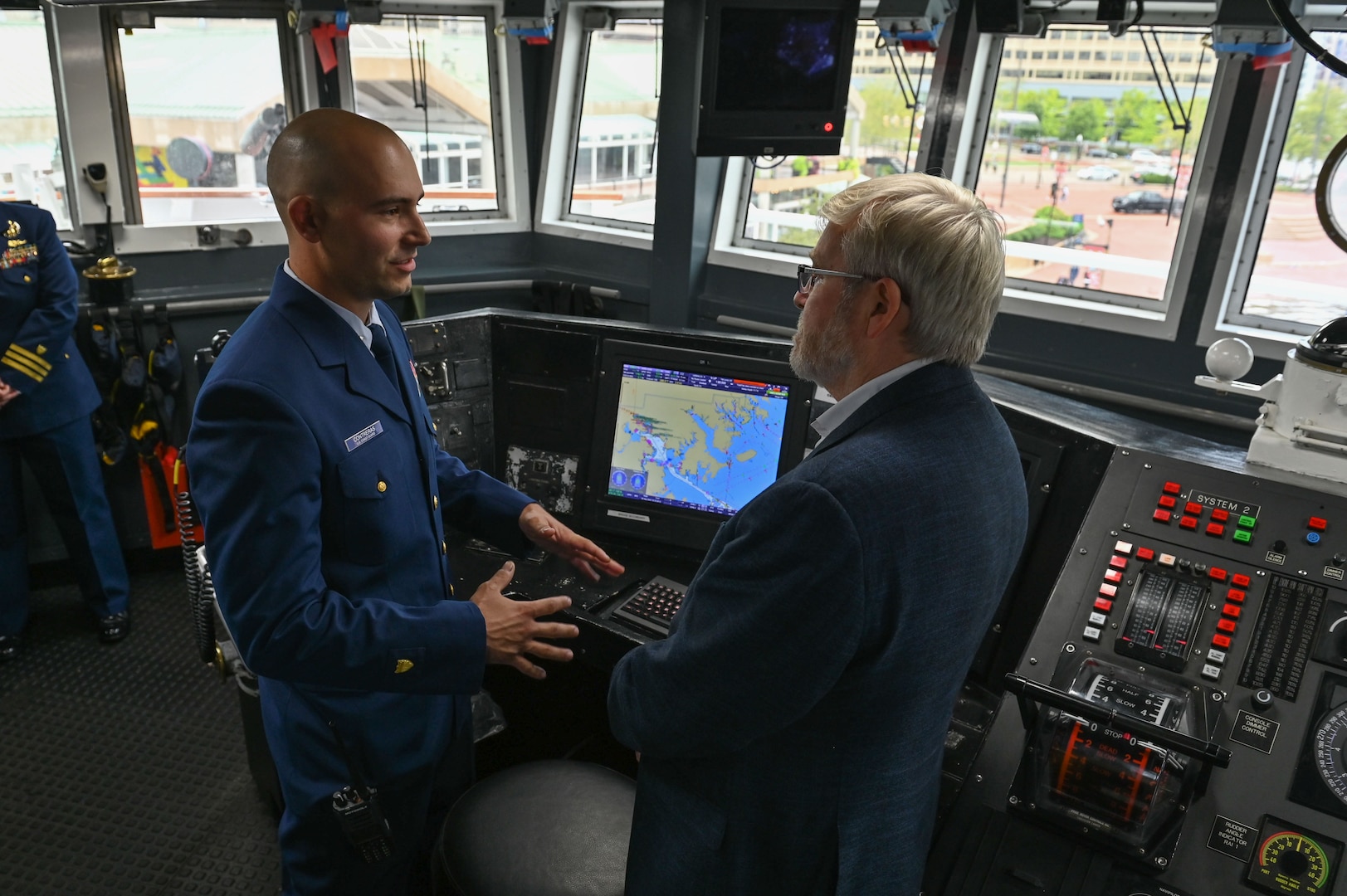 Petty Officer 2nd Class Eric Contreras speaks with Kevin Rudd, Ambassador of Australia to the United States, on the bridge of the Coast Guard Cutter Forward (WMEC 911) while the cutter was moored in Baltimore, Sept. 24, 2023. The cutter tour was a prelude to the official start of the U.S.- PIF Summit hosted by Commandant of the Coast Guard, Adm. Linda Fagan, and widely attended by Pacific Island leaders. (U.S. Coast Guard photo by Petty Officer 3rd Class Mikaela McGee).