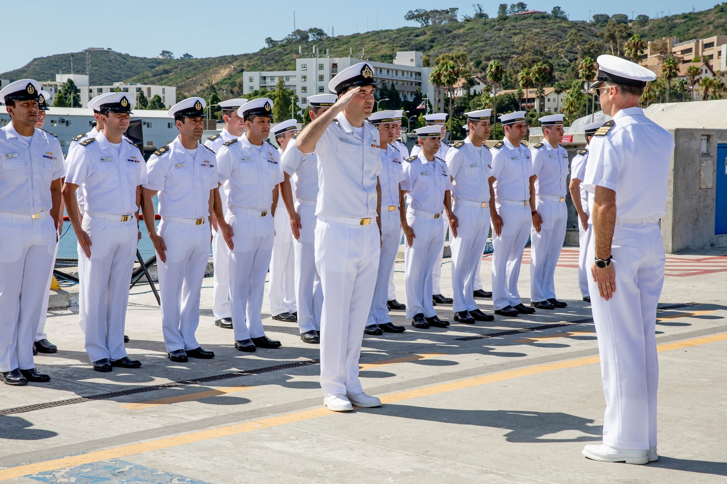 Sailors assigned to the Chilean Navy submarine CS Carrera (SS 22) exchange a salute during a Chilean Independence Day ceremony held on board Naval Base Point Loma, Sept. 18.