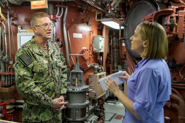 Vice Admiral Wolfe listens to and answers questions asked by Courtney Kube (right) of NBC aboard the Ohio-class ballistic missile submarine USS Louisiana (SSBN 743) during Demonstration and Shakedown Operation-32 (DASO-32) off the coast of Southern California on Lousiana's bridge.