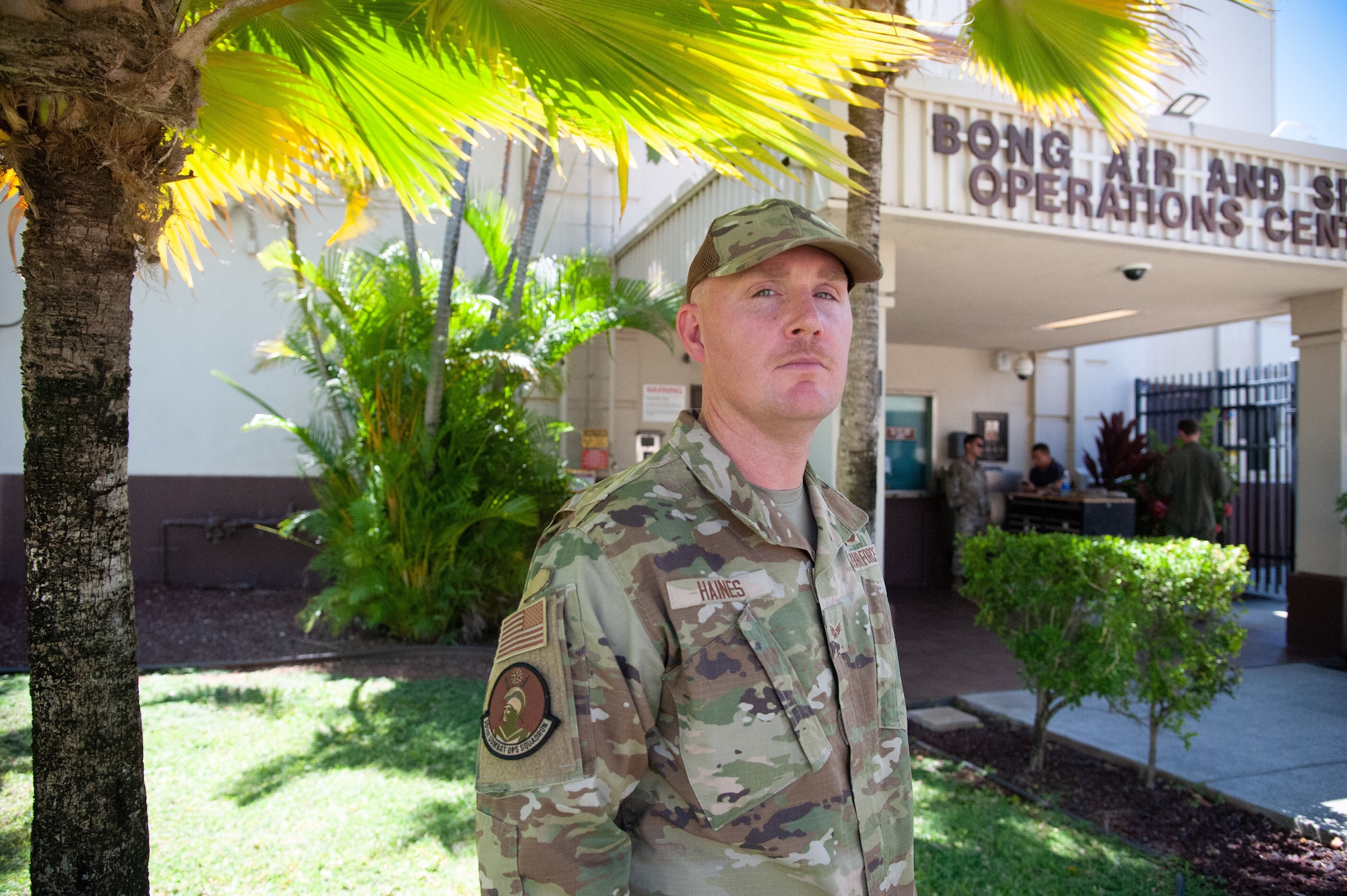 U.S. Air Force Senior Airman Cory Haines, 613th Air Operations Center imagery analyst, in front of the Joint Base Pearl Harbor-Hickam Air Operations Center in Hawaii Aug. 29., 2023. Haines is the Pacific Air Forces 2023 Air Force Intelligence, Surveillance and Reconnaissance Awards Program winner for Outstanding ARC ISR Airman of the Year.