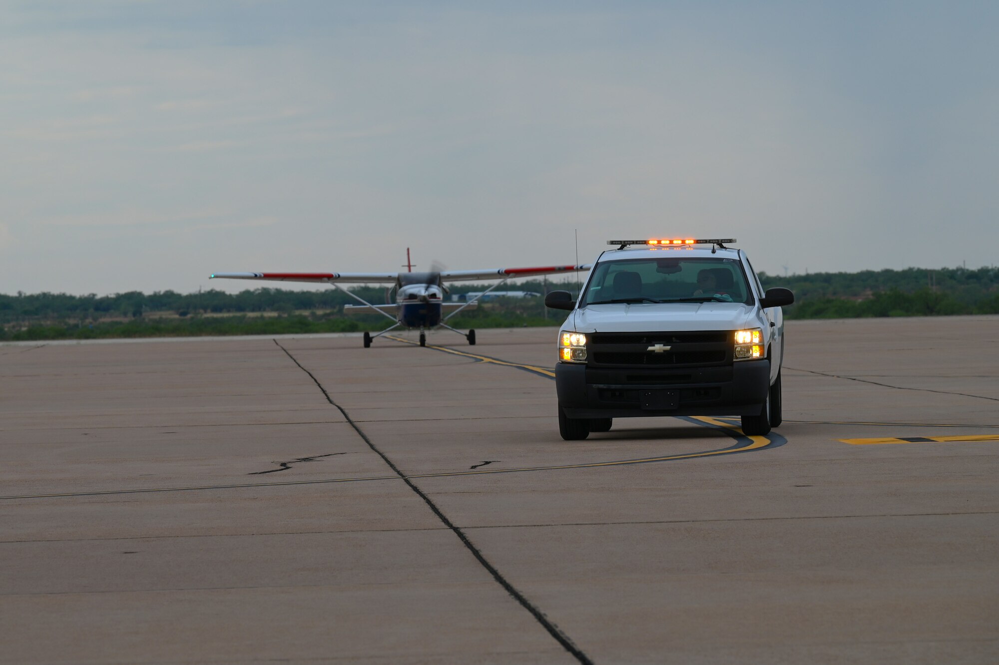 A Cessna 182 Skylane follows a truck down the flightline at Dyess Air Force Base, Texas, Sept. 21, 2023. The Civil Air Patrol delivered a crew entry door needed to repair a B-1B Lancer. (U.S. Air Force photo by Senior Airman Sophia Robello)